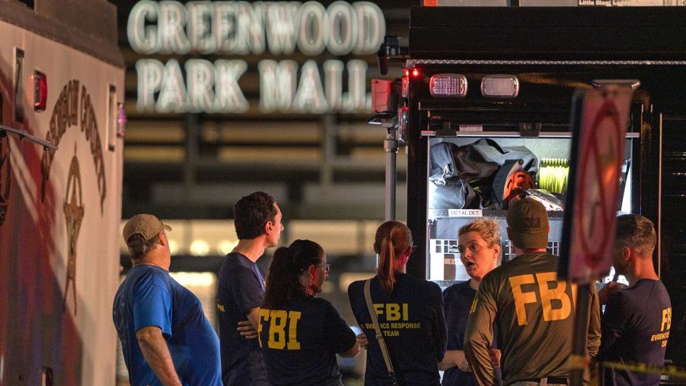 FBI agents gather at the scene of a deadly shooting, Sunday, July 17, 2022, at the Greenwood Park Mall, in Greenwood, Ind. (Kelly Wilkinson/The Indianapolis Star via AP)