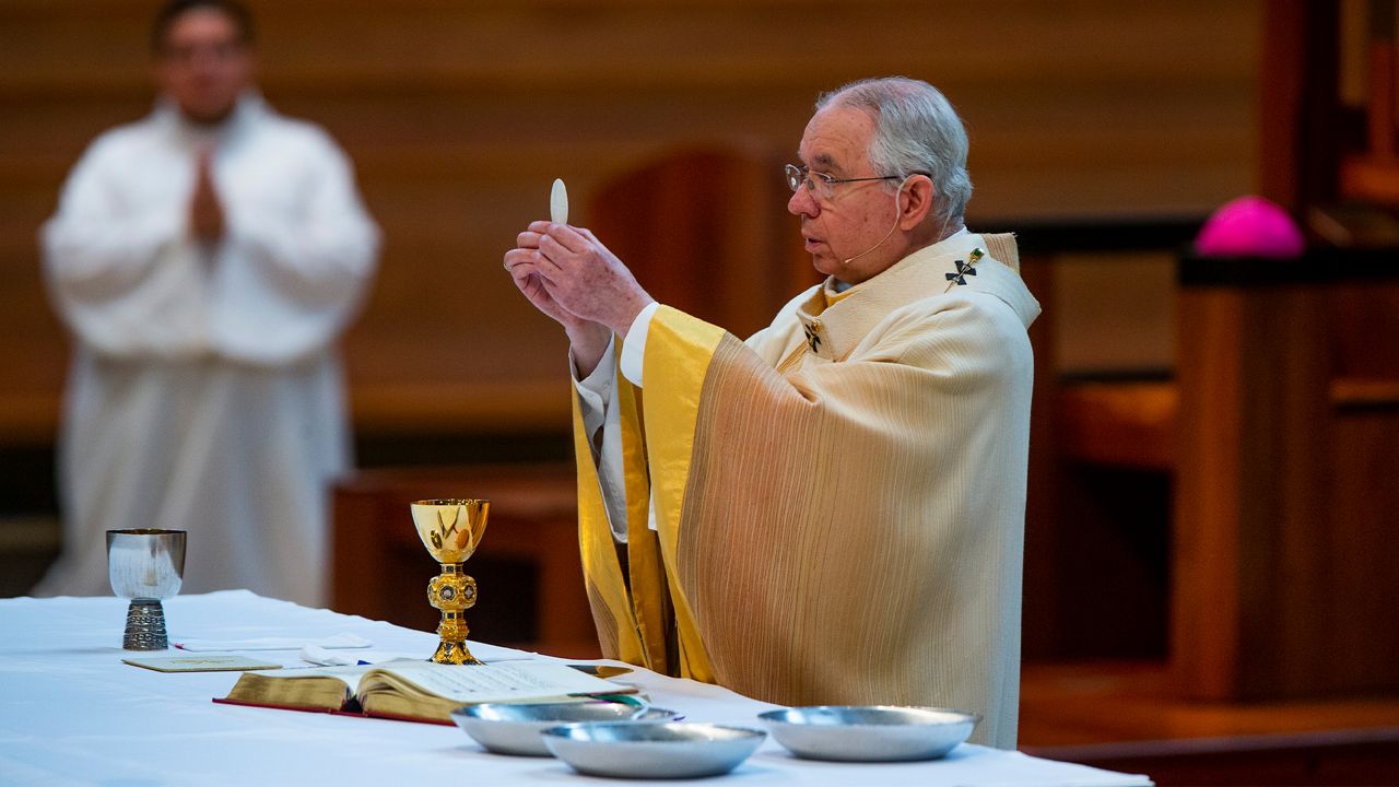 Archbishop Jose H. Gomez celebrates the the Solemnity of the Most Holy Trinity, a Mass with churchgoers present at the Cathedral of Our Lady of the Angels in downtown Los Angeles on Sunday, June 7, 2020.  (AP Photo/Damian Dovarganes)