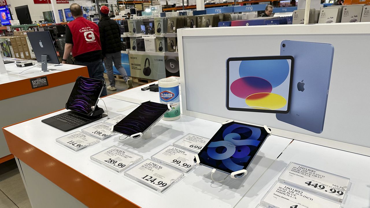 Apple iPads are displayed in a Costco warehouse Sunday, March 17, 2024, in Sheridan, Colo. (AP Photo/David Zalubowski, File)