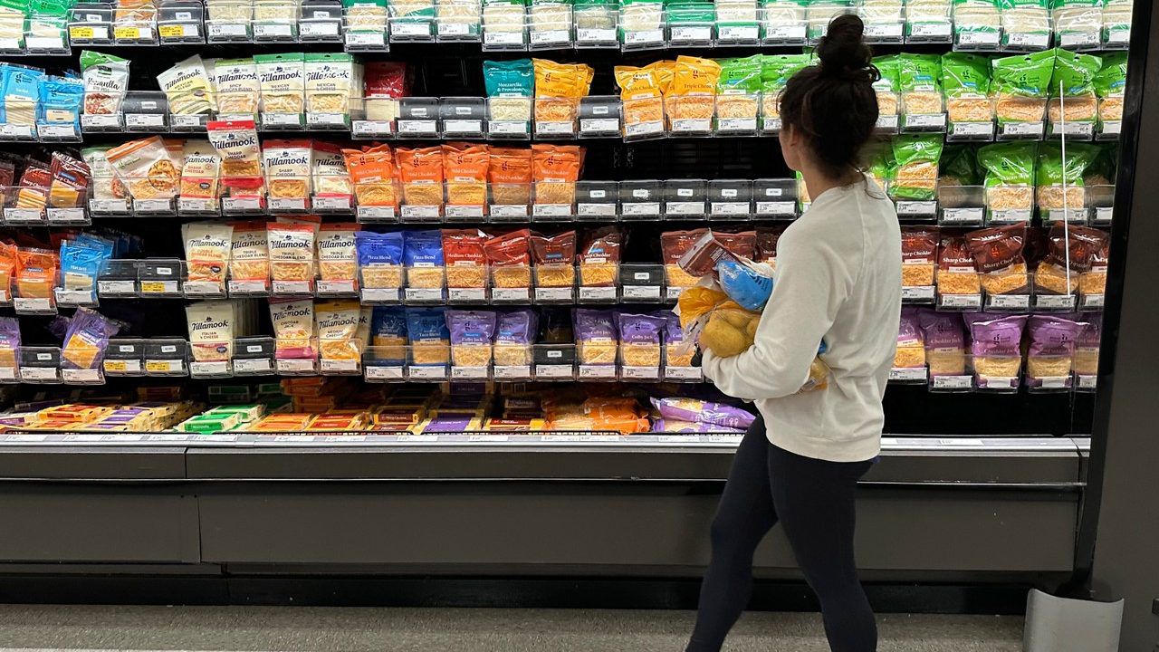 A shopper peruses cheese offerings at a Target store Wednesday, Oct. 4, 2023, in Sheridan, Colo. (AP Photo/David Zalubowski)