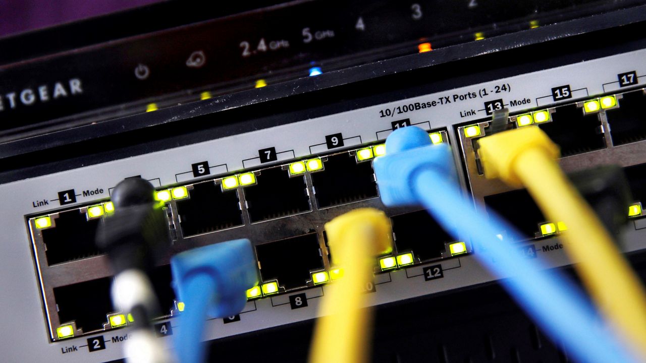 A home router and internet switch are displayed on June 19, 2018, in East Derry, N.H. (AP Photo/Charles Krupa)