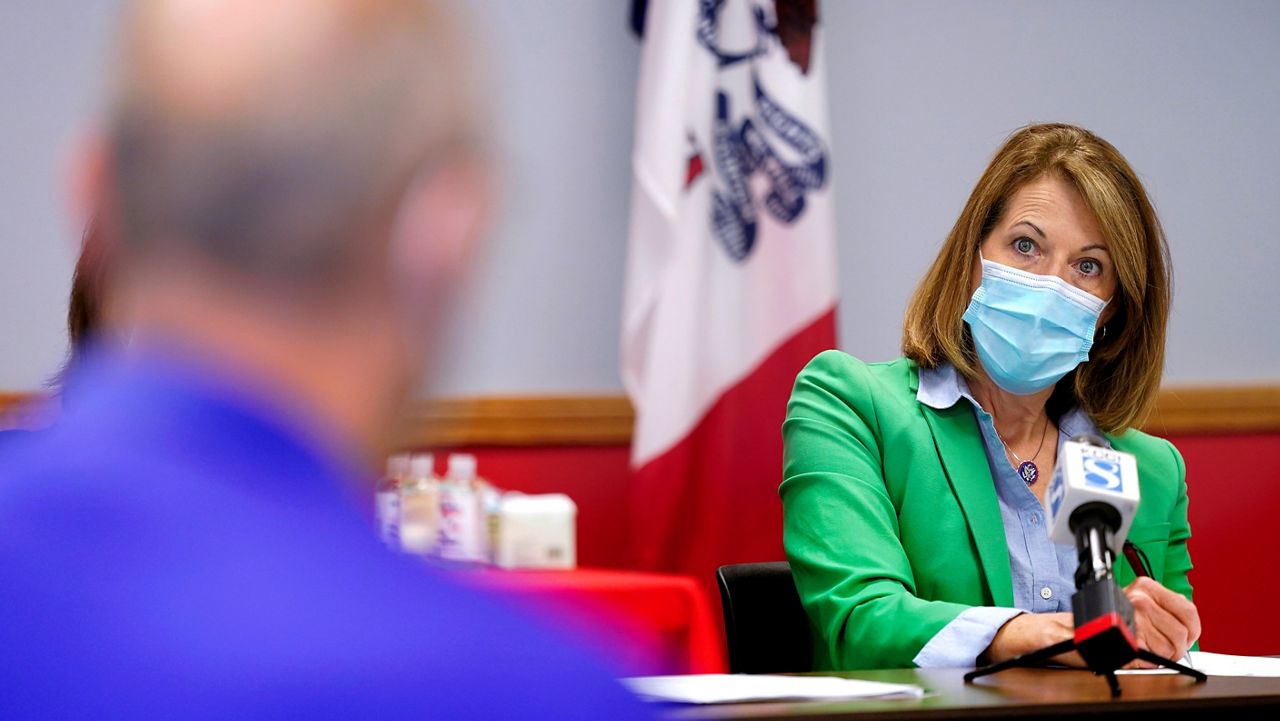 In this Sept. 2, 2021, photo Rep. Cindy Axne, D-Iowa, speaks about the Rural Reinvestment Task Force during a meeting with local officials in Indianola, Iowa. (AP Photo/Charlie Neibergall)