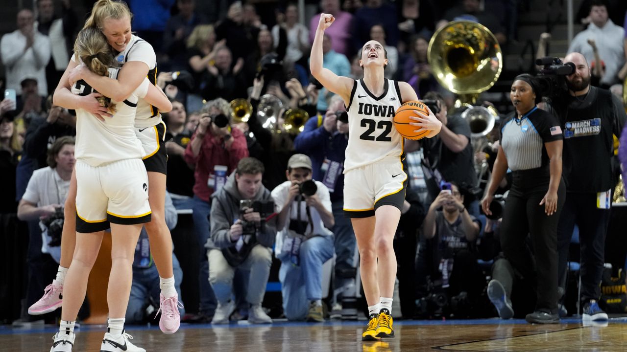 iowa basketball players celebrate