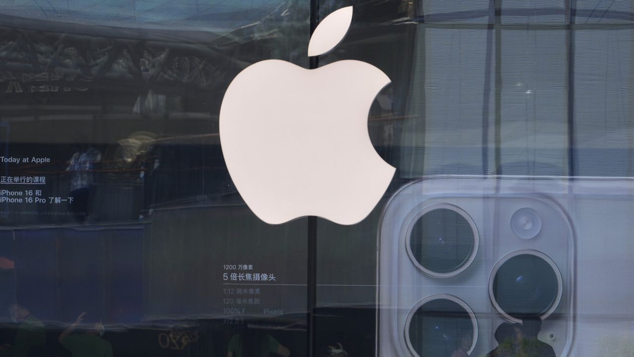 People visit an Apple store promoting its iPhone 16 at an outdoor shopping mall in Beijing, Sunday, May 11, 2025. (AP Photo/Andy Wong)