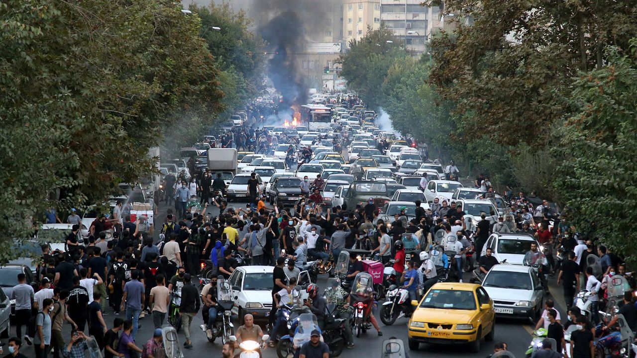 PProtesters in downtown Tehran, Iran, chant slogans Wednesday during a protest over the death of a woman who was detained by the morality police. (AP Photo)