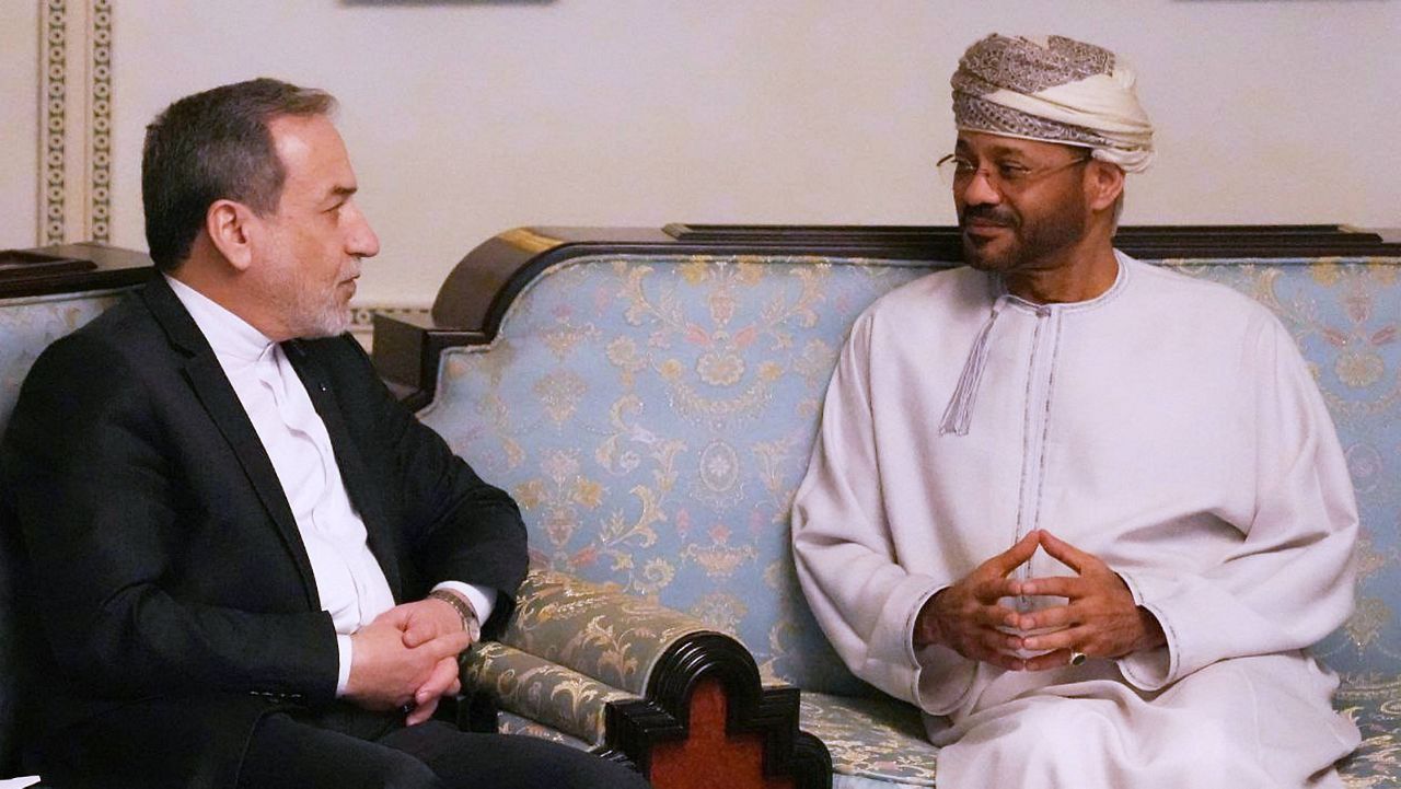 In this photo released by the Iranian Foreign Ministry, Iranian Foreign Minister Abbas Araghchi, left, speaks with his Omani counterpart Sayyid Badr Albusaidi during their meeting prior to Iran and the U.S. negotiations, in Muscat, Oman, Friday, Feb. 6, 2026. (Iranian Foreign Ministry via AP)