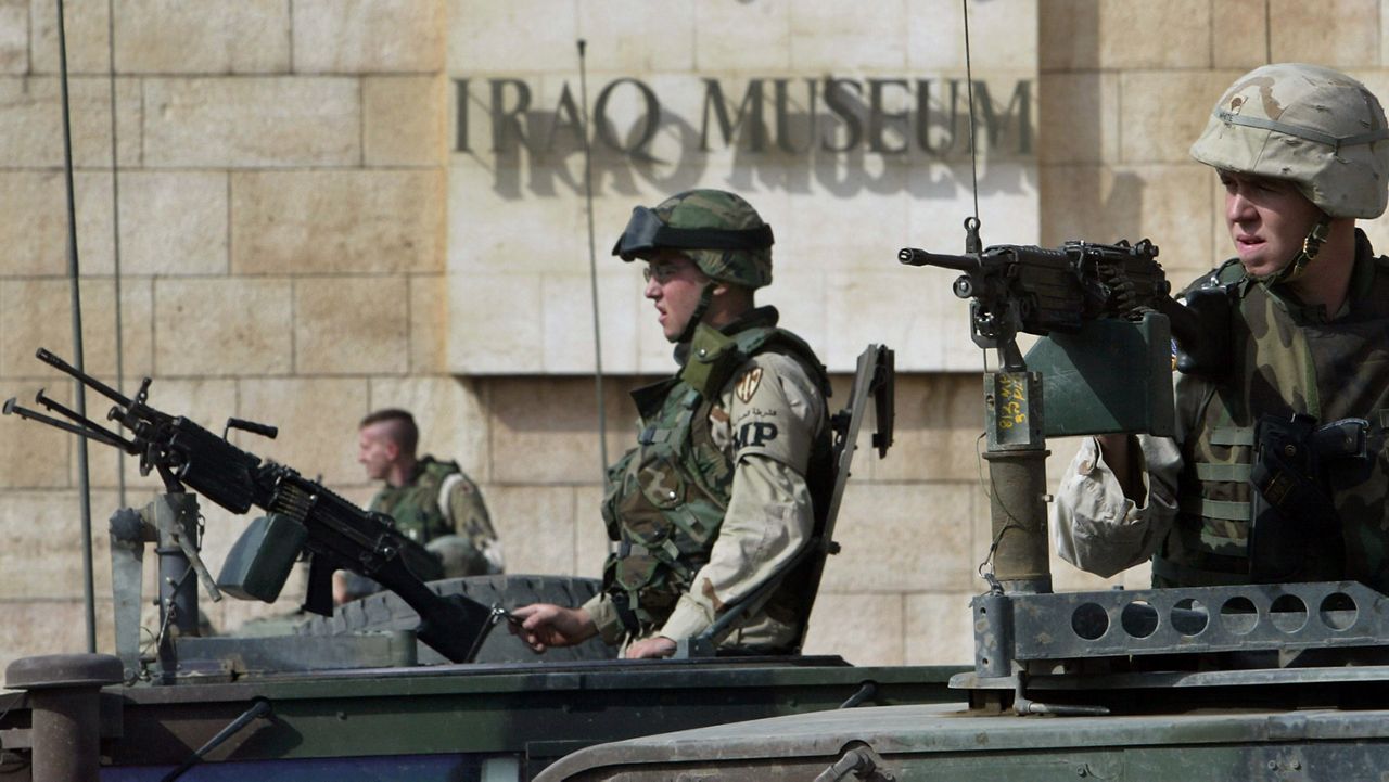  U.S. Army soldiers secure the Iraqi Museum in Baghdad, in this Tuesday, Nov. 11, 2003 file photo. When Baghdad fell to the U.S.-led coalition that toppled Saddam Hussein, the world watched in horror as looters ransacked the museum that housed some of the nation's most prized treasures. (AP Photo/Anja Niedringhaus, File)