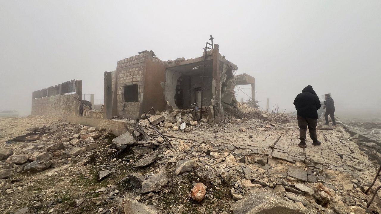 FILE - Syrians look at an abandoned medical facility in the village of Talteta, Syria, Tuesday, Jan. 16, 2024, that was hit by Iranian missiles late Monday night, according to a voluntary rescue group White Helmets. (AP Photo/Omar Albam)