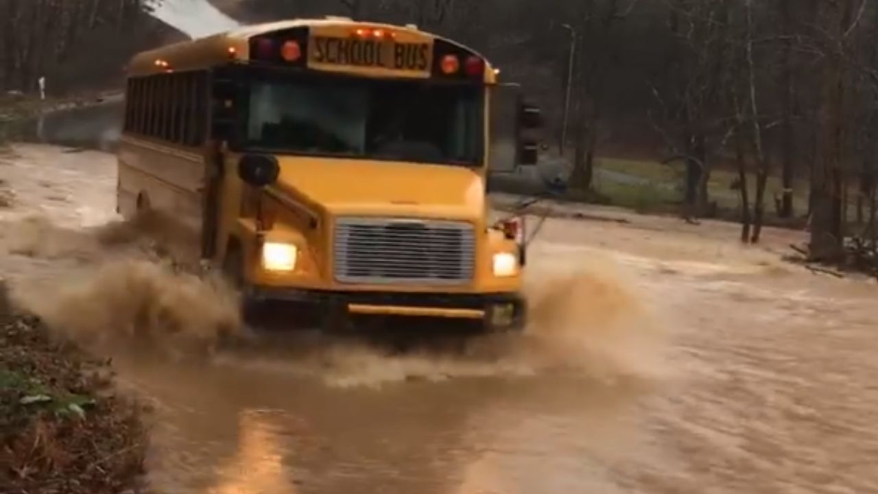 Iredell-Statesville bus seen driving through flood waters