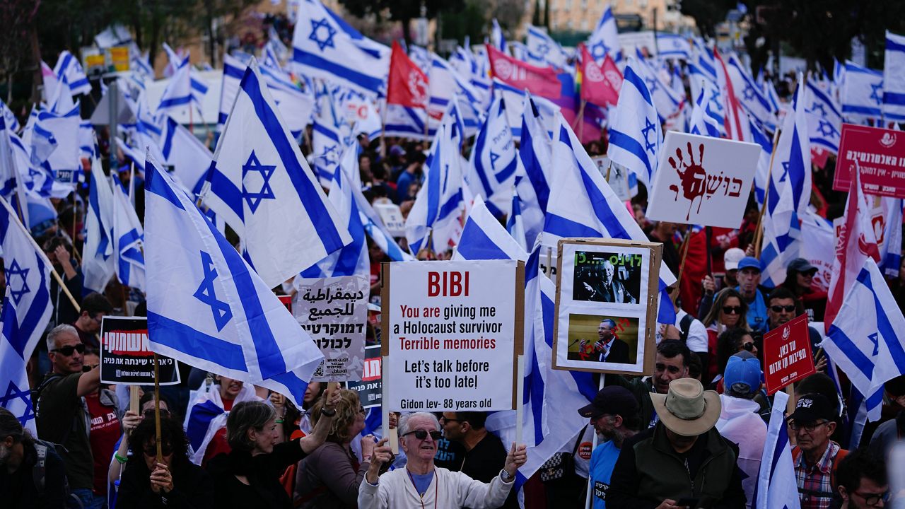 Israelis protest in March against Prime Minister Benjamin Netanyahu's judicial overhaul plan outside the Parliament in Jerusalem. (AP Photo/Ariel Schalit)