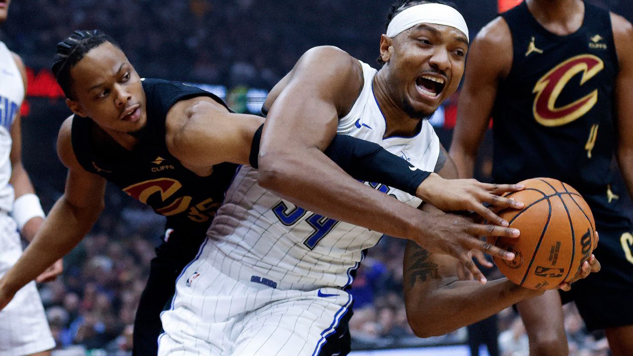 Magic center Wendell Carter Jr. (34) controls a rebound against Cavaliers forward Isaac Okoro on April 30, 2024 during Game 5 in the teams' 1st-round NBA playoff series. (AP Photo/Ron Schwane)