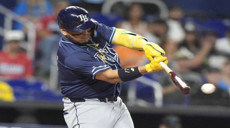 Tampa Bay Rays' Isaac Paredes hits a RBI double to score Randy Arozarena and Brandon Lowe during the first inning of a baseball game against the Miami Marlins, Wednesday, June 5, 2024, in Miami. (AP Photo/Lynne Sladky)