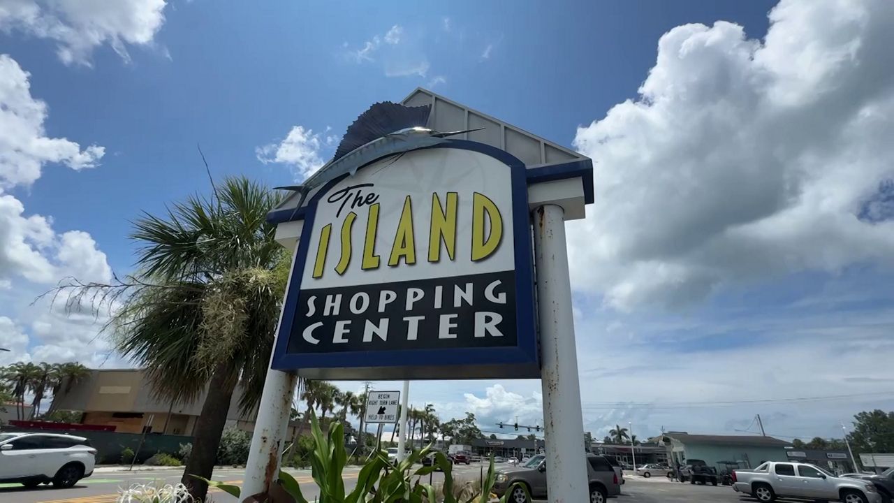 Signage for the Island Shopping Center in Holmes Beach where a grand reopening ceremony will be held Friday, June 6 for businesses impacted by Hurricane Helene. (Spectrum News)