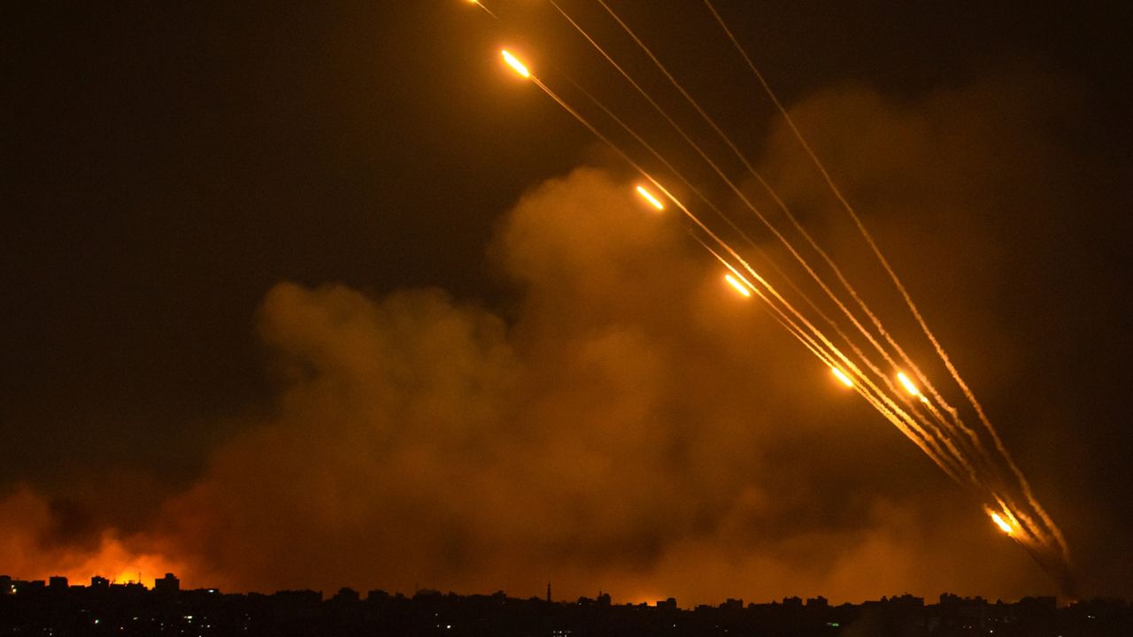 Rockets are fired toward Israel from the Gaza Strip, Sunday, Oct. 8, 2023. (AP Photo/Fatima Shbair)