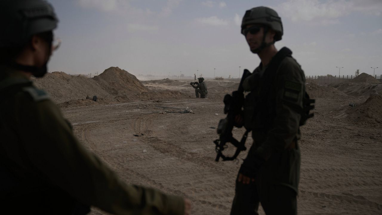 Israeli soldiers take up positions next to the Philadelphi Corridor along the border with Egypt, in the Gaza Strip on Friday, Sept. 13, 2024. (AP Photo/Leo Correa)