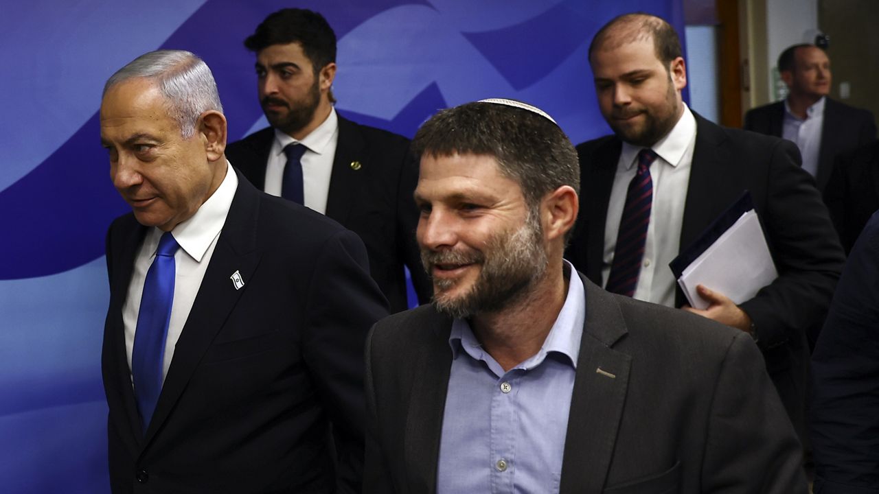 Israeli Prime Minister Benjamin Netanyahu, left, and Finance Minister Bezalel Smotrich, right, arrive to attend a cabinet meeting at the prime minister's office in Jerusalem on Feb. 23. (Ronen Zvulun/Pool Photo via AP, File) 