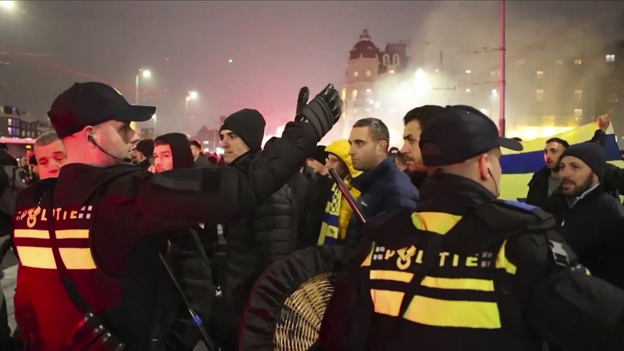 In this image taken from video, police stand guard forming a line near the Ajax stadium, in Amsterdam, the Netherlands, Thursday, Nov. 7, 2024. (AP Photo InterVision)