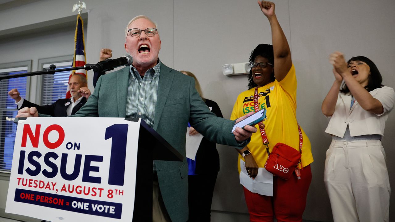 Dennis Willard, spokesperson for One Person One Vote, celebrates the results of the election during a watch party Tuesday, Aug. 8, 2023, in Columbus, Ohio. Ohio voters have resoundingly rejected a Republican-backed measure that would have made it more difficult to pass abortion protections. Missouri voters could be asked to change the thresholds necessary for passing statewide constitutional amendments next year. (AP Photo/Jay LaPrete)