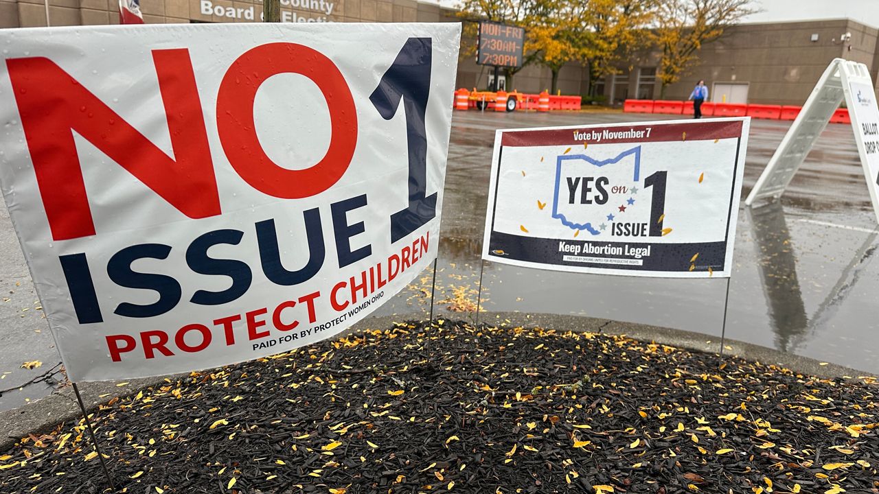 Signs for and against Issue 1 are displayed outside the Franklin County Board of Elections. (Spectrum News 1/Jenna Jordan)