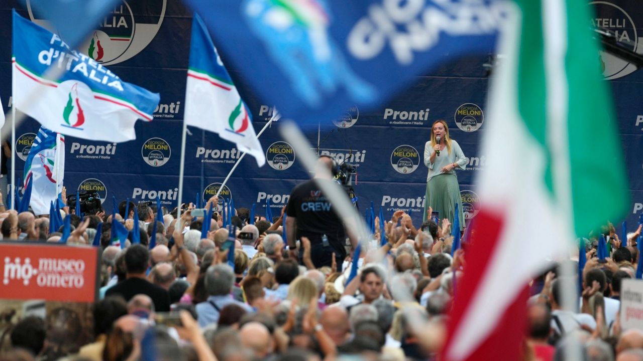 Brothers of Italy's leader Giorgia Meloni, center-right on stage, addresses a rally on Aug. 23 in Ancona, Italy. (AP Photo/Domenico Stinellis, File)