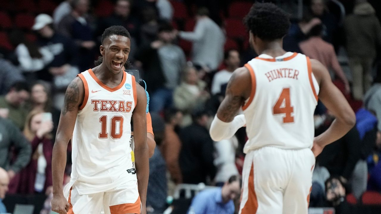 Texas' Sir'Jabari Rice and Tyrese Hunter celebrate after a second-round college basketball game against Penn State in the NCAA Tournament Saturday, March 18, 2023, in Des Moines, Iowa. (AP Photo/Morry Gash)