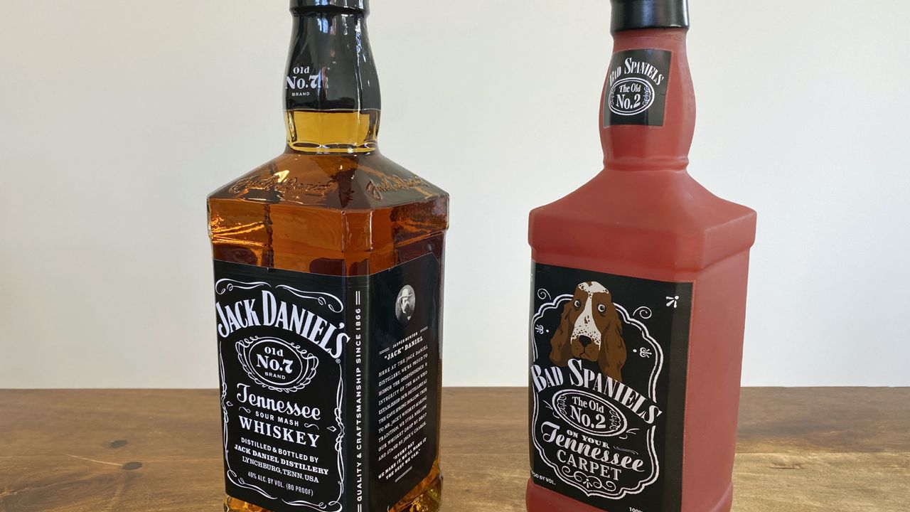 A bottle of Jack Daniel's Tennessee Whiskey is displayed next to a Bad Spaniels dog toy in Arlington, Va., Sunday, Nov. 20, 2022. Jack Daniel's has asked the Supreme Court justices to hear its case against the manufacturer of the toy. (AP Photo/Jessica Gresko)