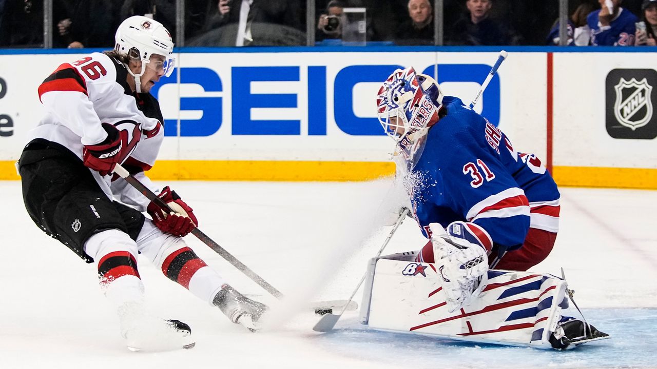 Jack Hughes shoots the puck past Igor Shesterkin during a game on Monday, April 24, 2023 in New York.