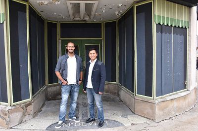 Brian Jackson (left) and Marvin Abrinica (right) at the ribbon-cutting announcing their plans for Esoteric Brewing on the first floor of the Paramount Building in Walnut Hills (Casey Weldon | Spectrum News 1)