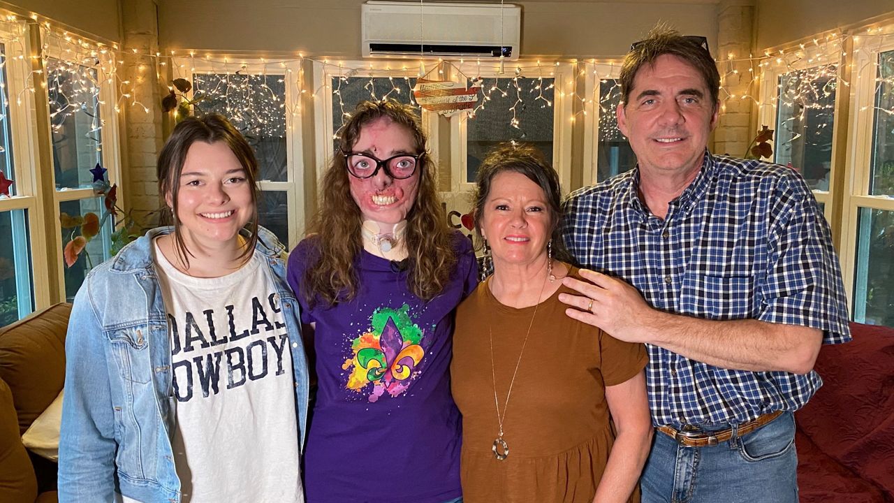 Jacqueline Durand smiles for a picture with her sister Barreca, and parents Shirley & John Durand. (Spectrum News 1/Lupe Zapata)