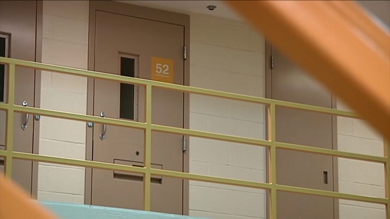 Officers warn the public of fake jail call scams