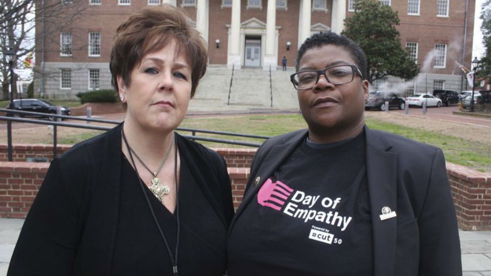 In this March 3, 2018 photo, Kimberly Haven, left, and Monica Cooper, two advocates for reforms in correctional facilities, pose for a photo in front of the Maryland State House in Annapolis, Md. Both Haven and Cooper, who are former inmates, testified in favor of a measure to ensure women have free access to menstrual products on request while in correctional facilities. Growing recognition about the lack of access to basic feminine hygiene products that can occur in correctional facilities has created a wave of measures in state legislatures. (AP Photo/Brian Witte)