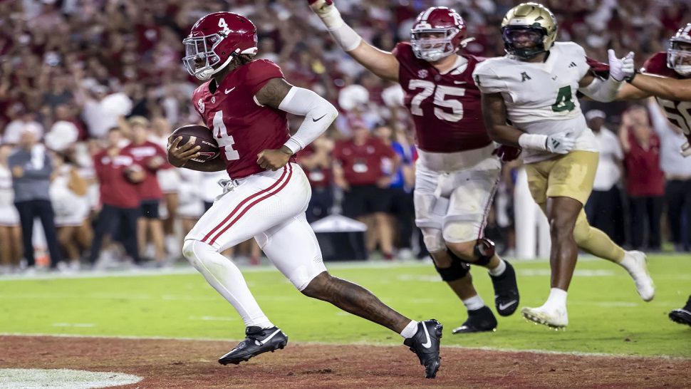 Alabama quarterback Jalen Milroe (4) runs the ball for his second rushing touchdown of the game against South Florida, during the first half of an NCAA college football game, Saturday, Sept. 7, 2024, in Tuscaloosa, Ala. (AP Photo/Vasha Hunt)