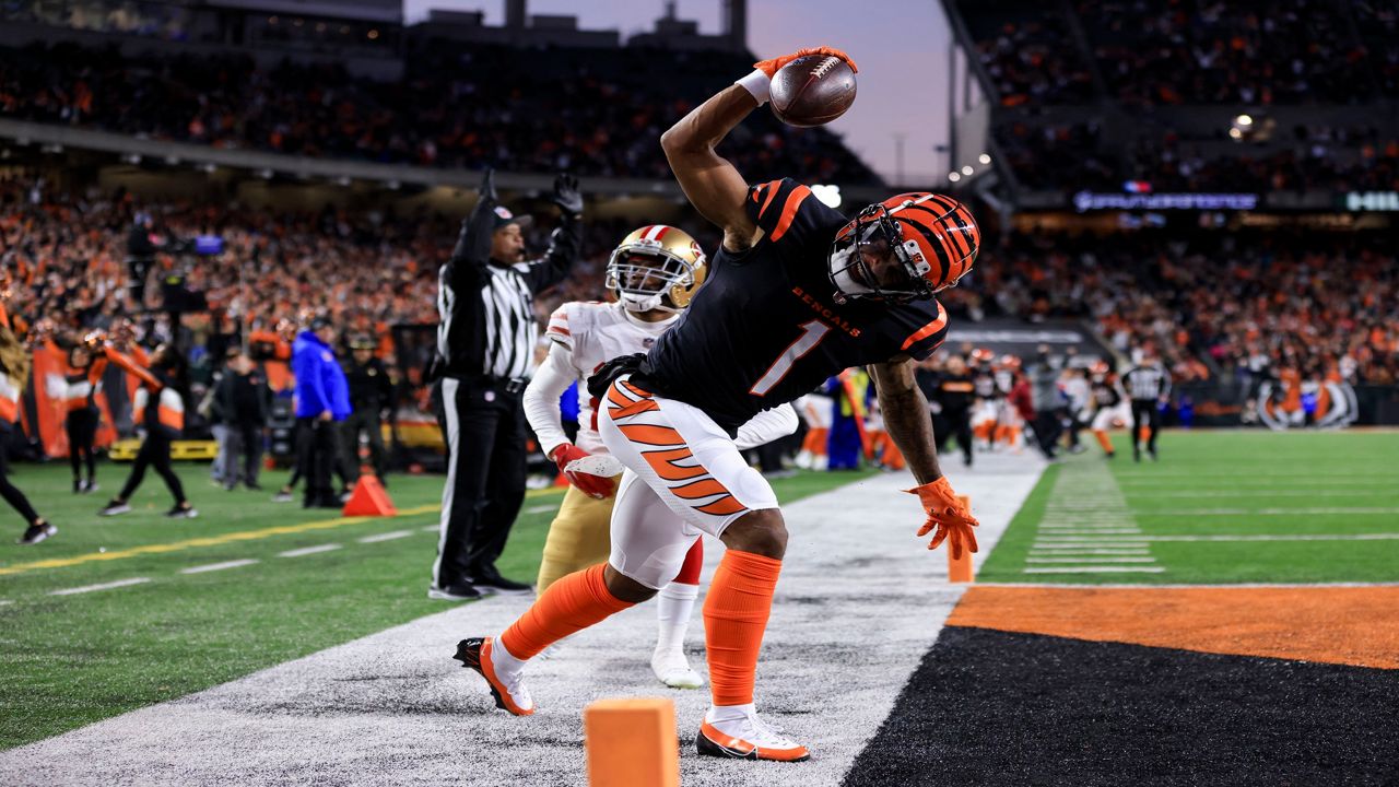Cincinnati Bengals wide receiver Ja'Marr Chase (1) spikes the football during an NFL football game against the San Francisco 49ers, Sunday, Dec. 12, 2021, in Cincinnati. San Francisco won 26-23 in overtime. (AP Photo/Aaron Doster)