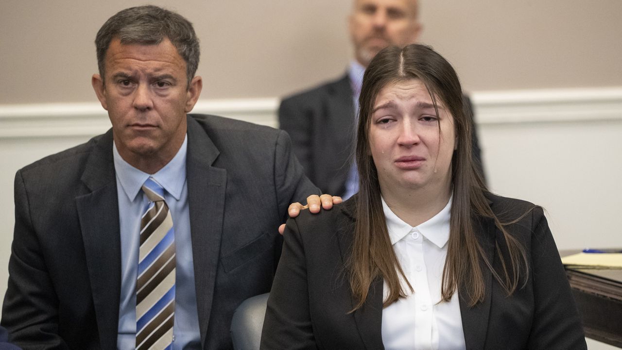 Tears fall down the cheeks of Jamie Lee Komoroski as family members of Samantha Miller speak about Miller during the plea hearing for Komoroski at Charleston County Court, Monday, Dec. 2, 2024, in Charleston, S.C. (Henry Taylor/The Post And Courier via AP)