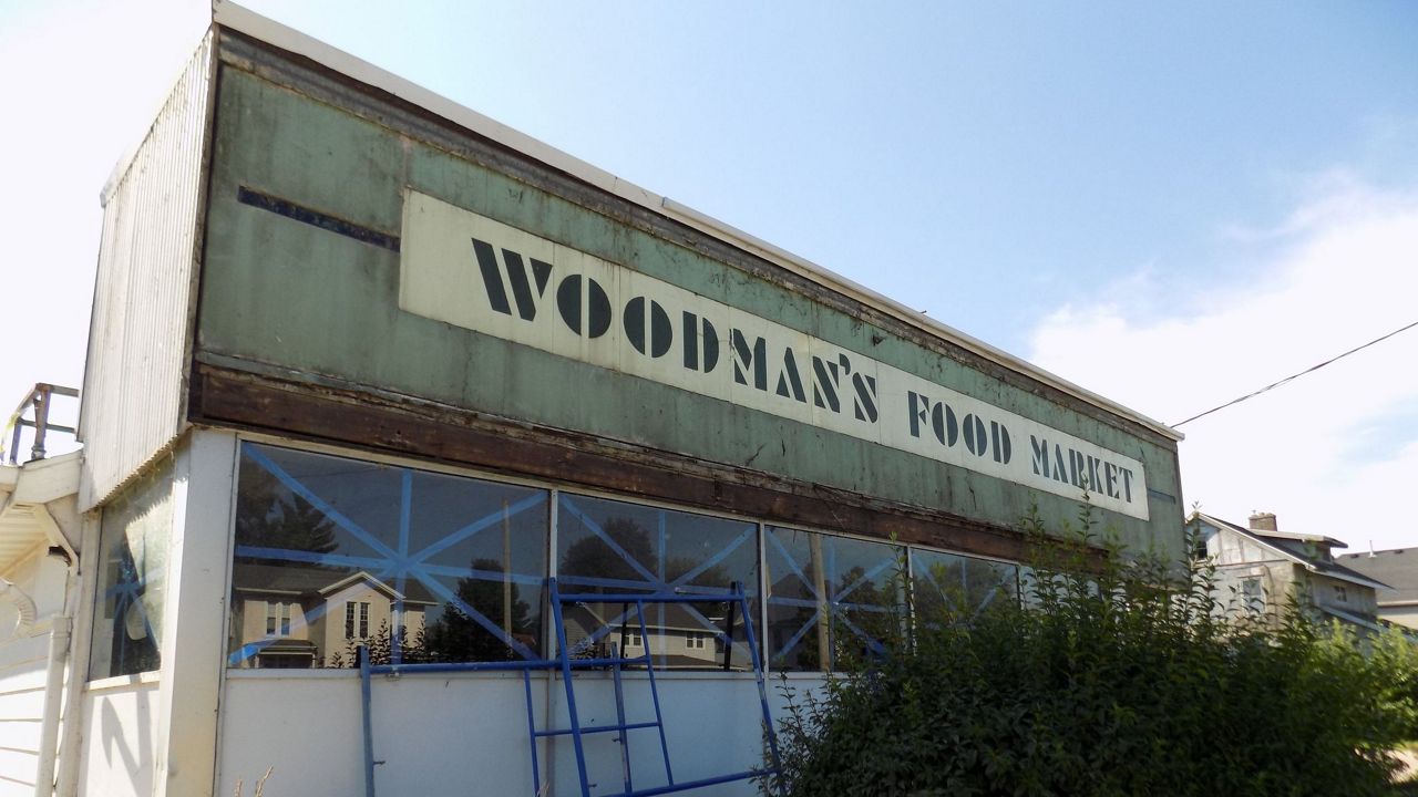 Historic Woodman’s sign unveiled amid Janesville renovation