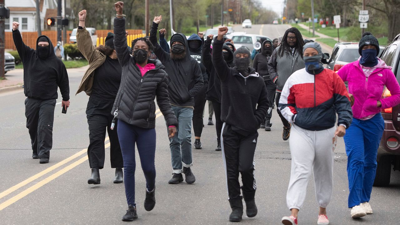 Protesters march and block traffic Monday, April 17, 2023, on Vernon Odom Blvd. after a grand jury decision not to charge eight Akron, Ohio police officers in the death of Jayland Walker last summer. (AP Photo/Phil Long)