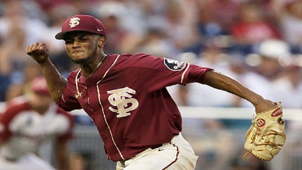 Florida State's J.C. Flowers (8) celebrates after the final out against Arkansas in an NCAA College World Series baseball game in Omaha, Neb., Saturday, June 15, 2019. AP Photo/Nati Harnik)