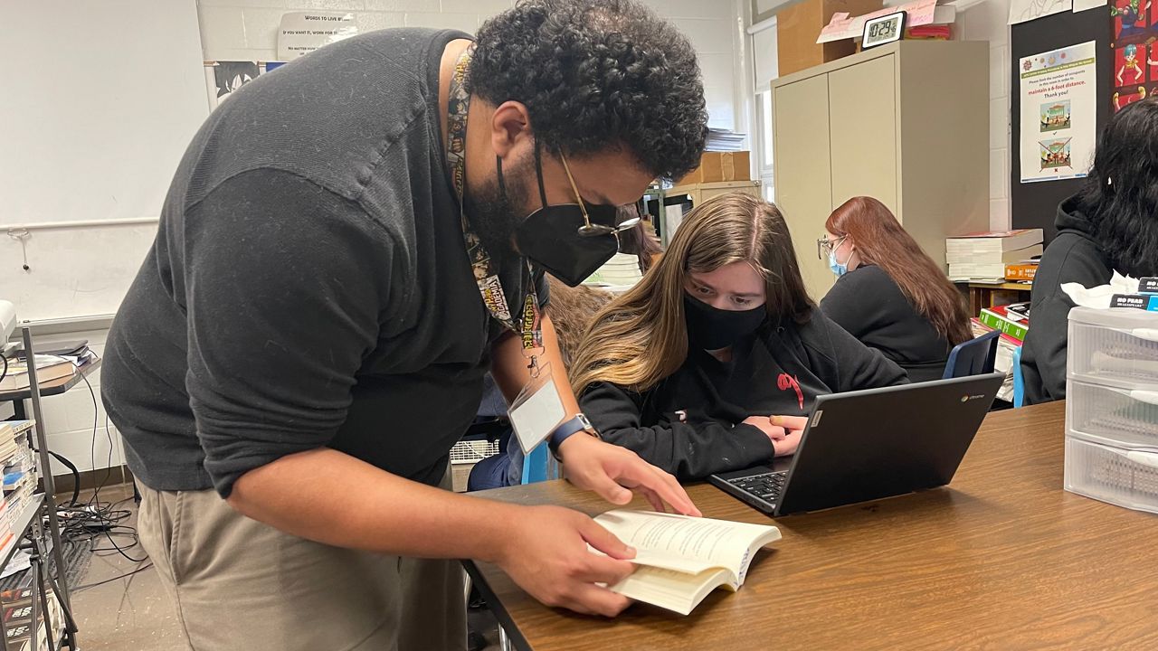 JCPS teacher Joseph Burrell works with students at Marion C. Moore School (Amber Smith/Spectrum News 1)