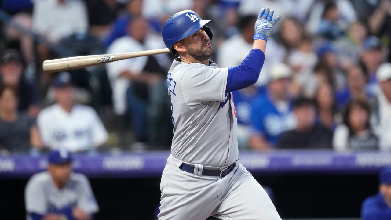 J.D. Martinez watches his home run during a baseball game on Sept. 28, 2023 in Denver.