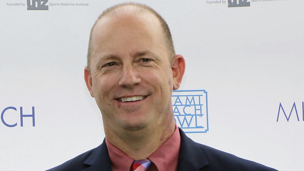 Jeff Brohm is greeted by family and friends 