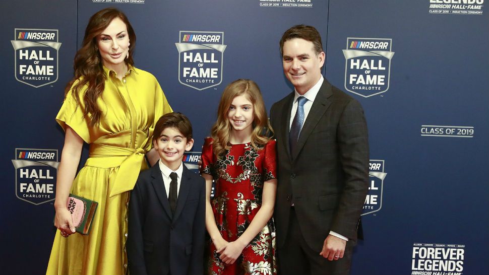 Former NASCAR driver Jeff Gordon, right, and his family from left: Ingrid Vandebosch, son Leo Benjamin and daughter Ella Sofia pose for photos before the NASCAR Hall of Fame induction ceremony for the Class of 2019, Friday, Feb. 1, 2019, in Charlotte, N.C. (AP Photo/Jason E. Miczek)