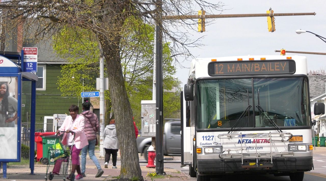 Bus dropping off passengers