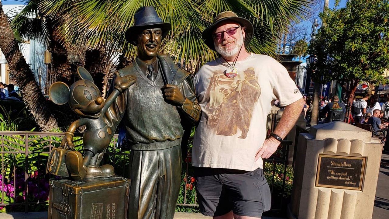 Jeff Reitz, 48, of Long Beach, poses next to a statue of Walt Disney at Disney California Adventure (courtesy Jeff Reitz)