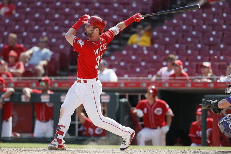 Cincinnati Reds' Jesse Winker bats during the fourth inning of