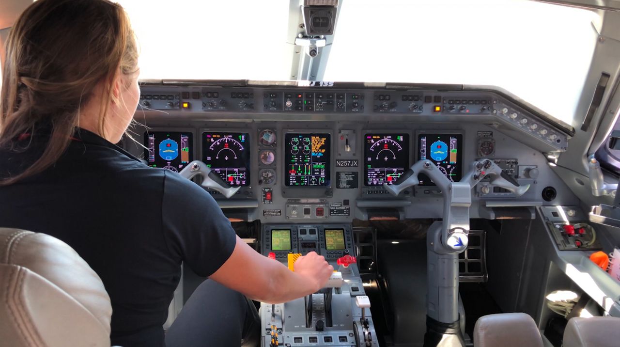 JetSuiteX pilot Amelia Kucharski getting ready to take-off in a 30-passenger Embraer 135