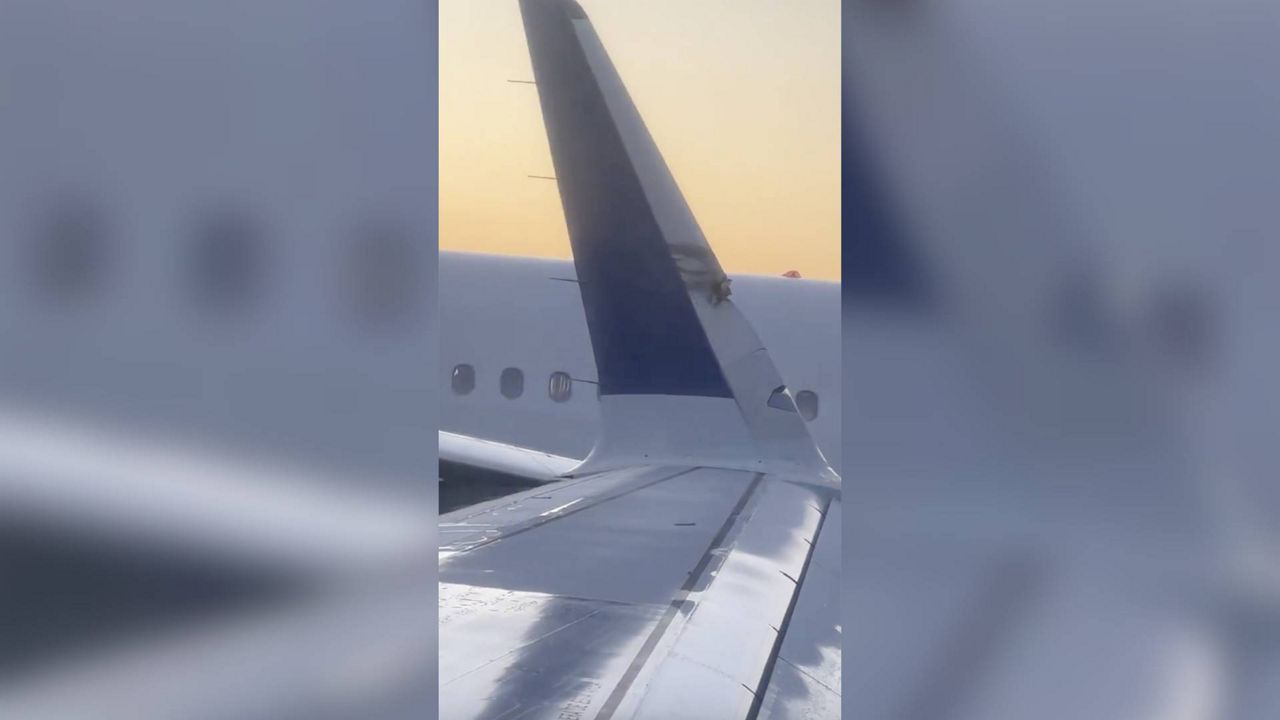 This image provided by Brian O'Neil shows a damaged plane's wingtip after two JetBlue planes made contact in a minor collision at Boston Logan International Airport on Thursday, Feb. 8, 2024 in Boston. (Brian O'Neil via AP)