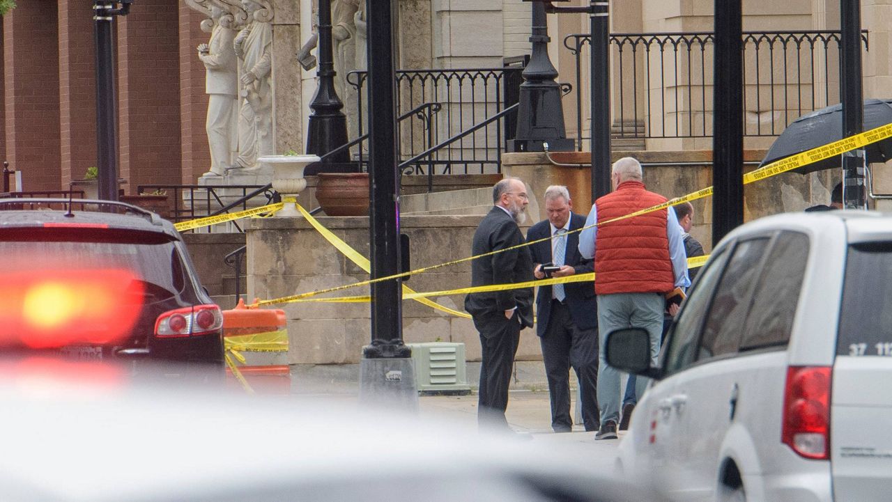 Law enforcement work the scene after two staff members of the Israeli Embassy in Washington were shot and killed outside the Capital Jewish Museum, Thursday, May 22, 2025, in Washington. (AP Photo/Rod Lamkey, Jr.)