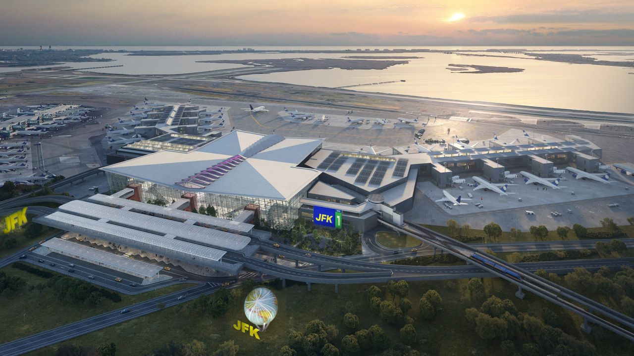 Exterior view of proposed terminal with water and skyline in the background and trees in the foreground