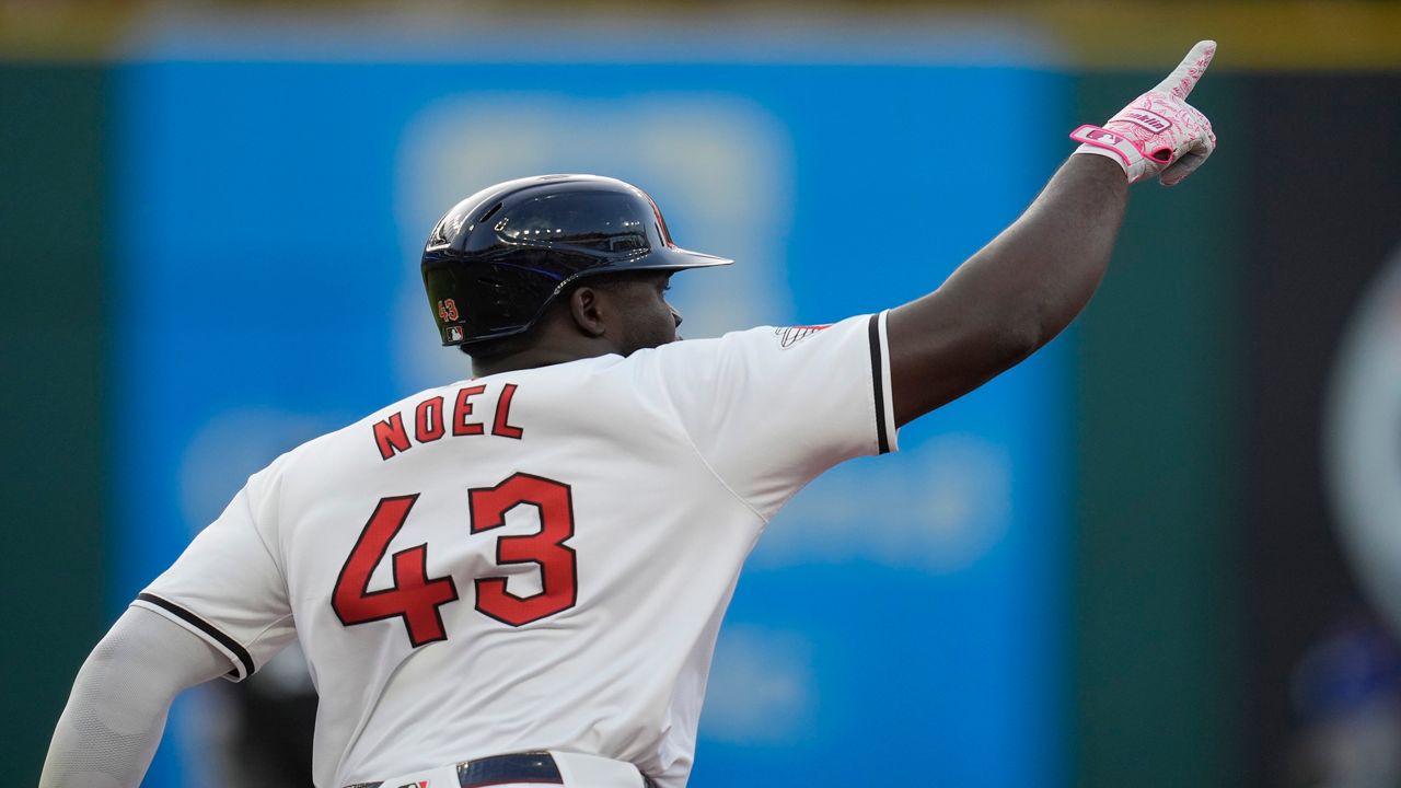 Cleveland Guardians' Jhonkensy Noel gestures as he runs the bases with a home run in the fourth inning of a baseball game against the Chicago Cubs Monday, Aug. 12, 2024, in Cleveland. (AP Photo/Sue Ogrocki)