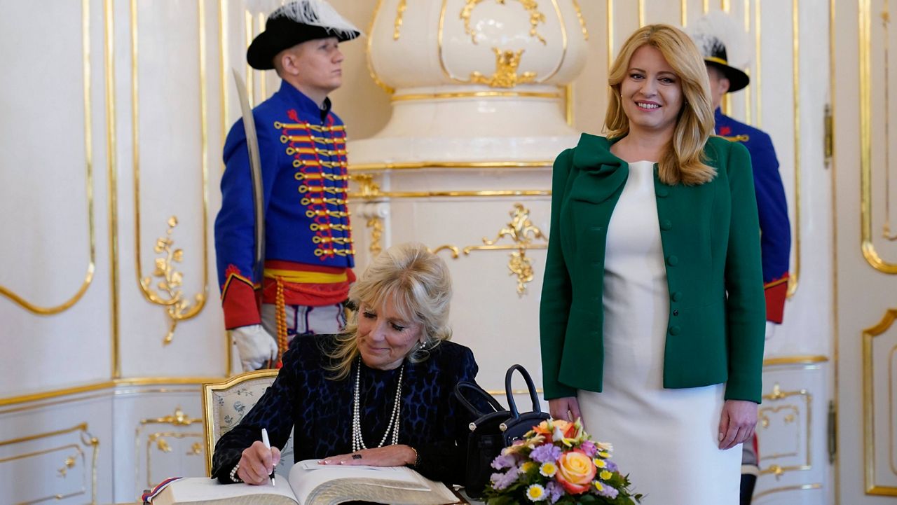 First lady Jill Biden signs a guest book Monday during her visit with Slovakian President Zuzana Caputova at the presidential palace in Bratislava, Slovakia. (AP Photo/Susan Walsh, Pool)